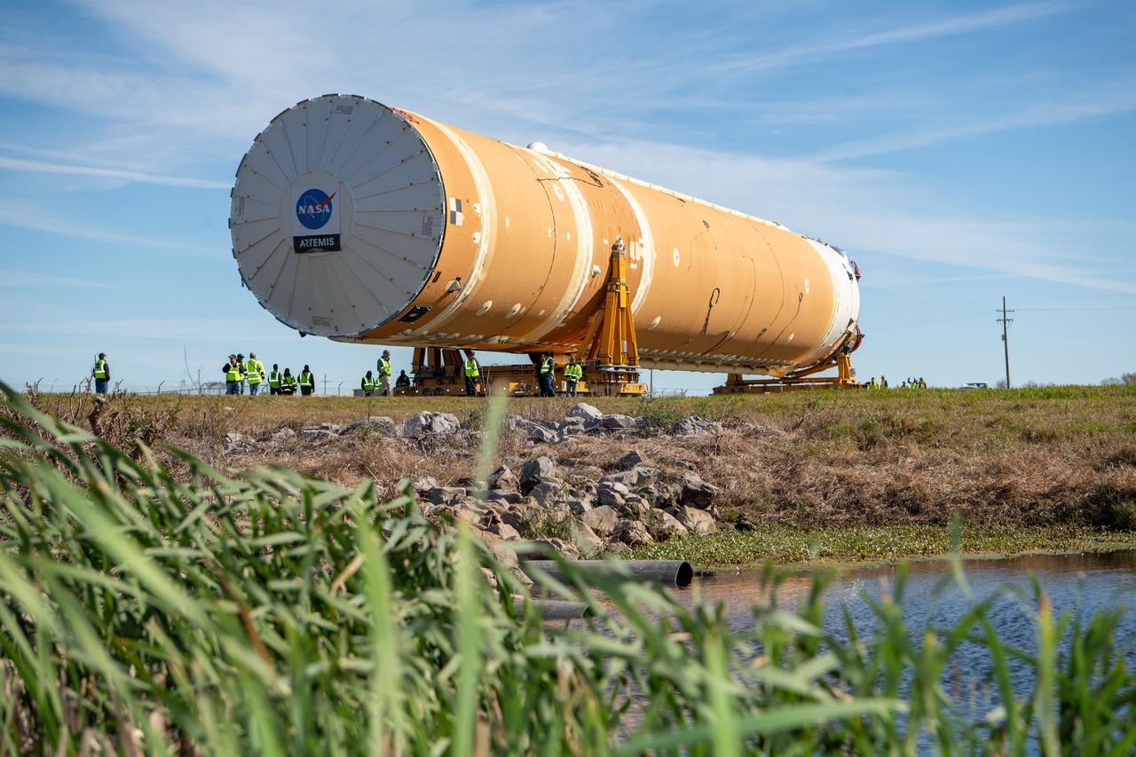 These images show how teams rolled out, or moved, the completed core stage for NASA’s Space Launch System rocket from NASA’s Michoud Assembly Facility in New Orleans. Crews moved the flight hardware for the first Artemis mission to NASA’s Pegasus barge on Jan. 8 in preparation for the core stage Green Run test series at NASA’s Stennis Space Center near Bay St. Louis, Mississippi. Pegasus, which was modified to ferry SLS rocket hardware, will transport the core stage from Michoud to Stennis for the comprehensive core stage Green Run test series. Once at Stennis, the Artemis rocket stage will be loaded into the B-2 Test Stand for the core stage Green Run test series. The comprehensive test campaign will progressively bring the entire core stage, including its avionics and engines, to life for the first time to verify the stage is fit for flight ahead of the launch of Artemis I.  Assembly and integration of the core stage and its four RS-25 engines has been a collaborative, multistep process for NASA and its partners Boeing, the core stage lead contractor, and Aerojet Rocketdyne, the RS-25 engines lead contractor. Together with four RS-25 engines, the rocket’s massive 212-foot-tall core stage — the largest stage NASA has ever built — and its twin solid rocket boosters will produce 8.8 million pounds of thrust to send NASA’s Orion spacecraft, astronauts and supplies beyond Earth’s orbit to the Moon and, ultimately, Mars. Offering more payload mass, volume capability and energy to speed missions through space, the SLS rocket, along with NASA’s Gateway in lunar orbit and Orion, is part of NASA’s backbone for deep space exploration and the Artemis lunar program.